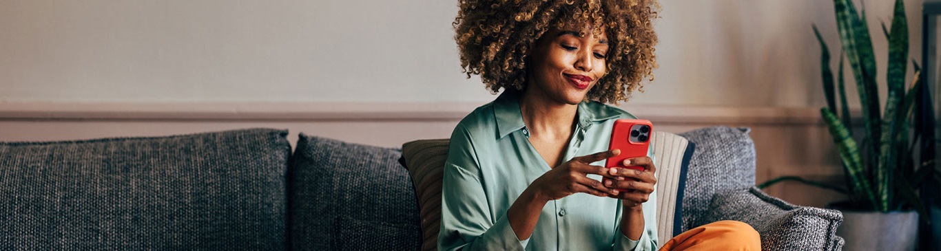 Woman paying bills on her smartphone