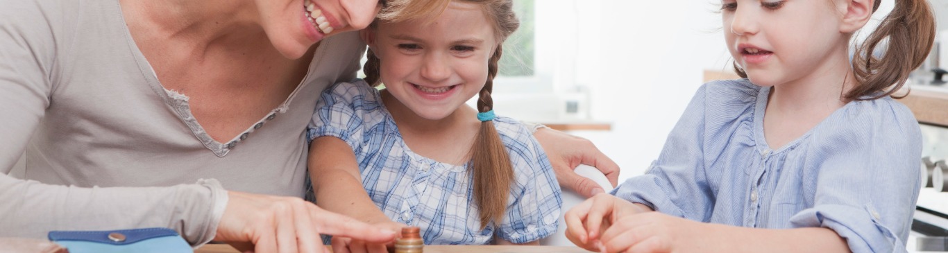 Mother with daughters counting coins