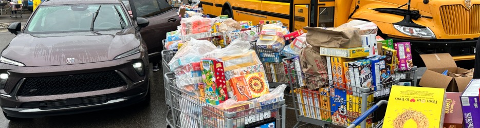 Car dropping off cereal boxes at Cereal Drive event