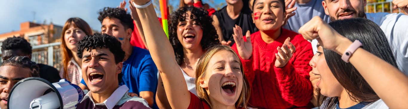 High schoolers cheering at game