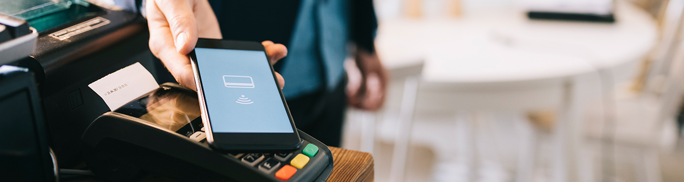 Man paying for lunch with his phone