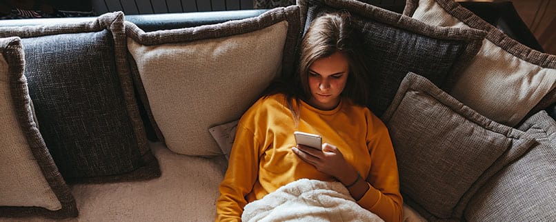 teenager browsing on phone