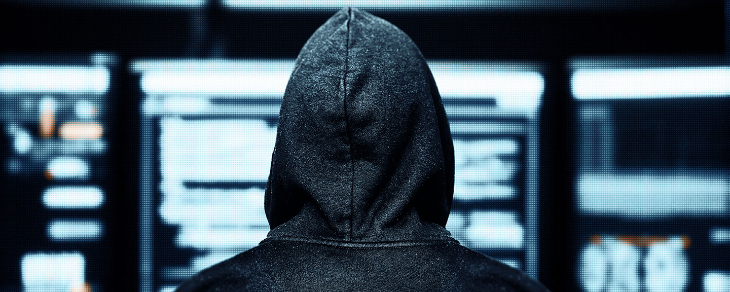 hacker at computer screen