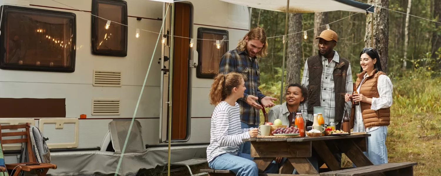 Friends camping outside RV