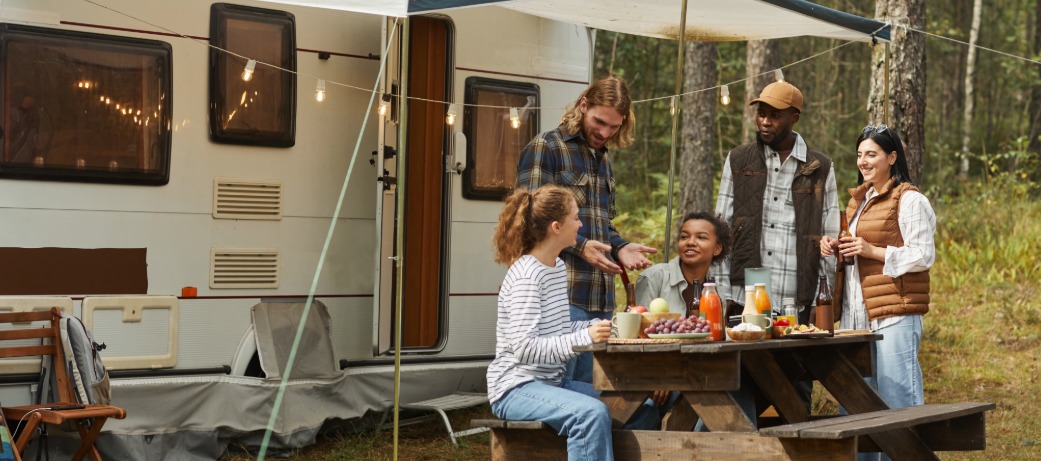 Friends camping outside RV