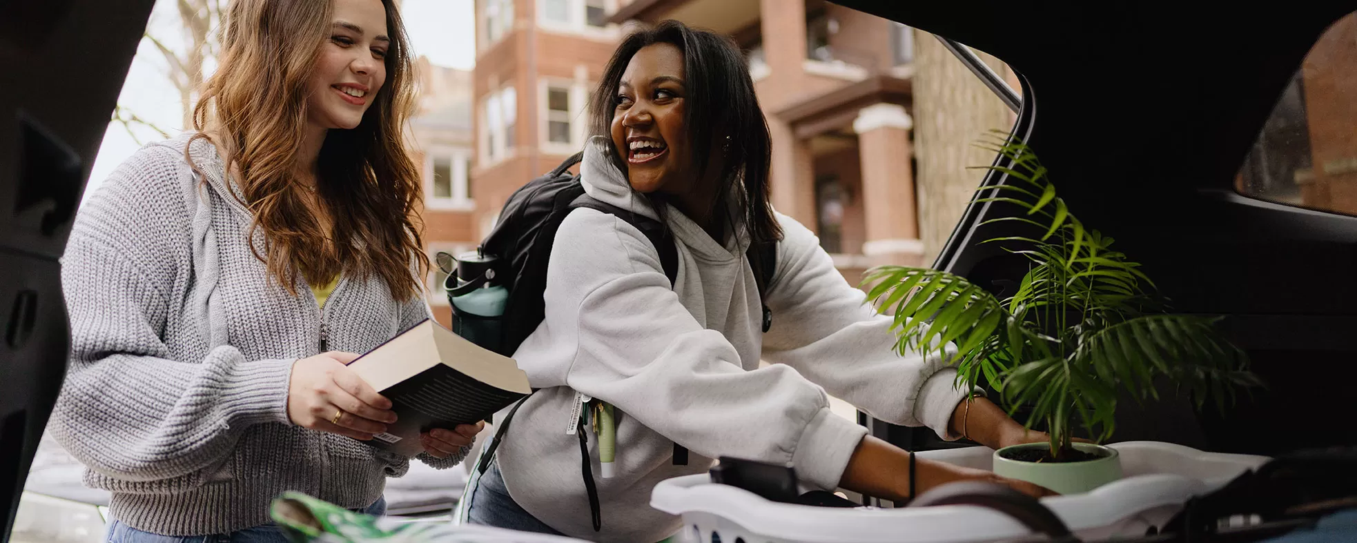 Friends packing their car before heading off to college