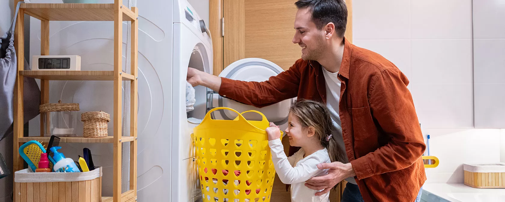 Father and daughter doing laundry