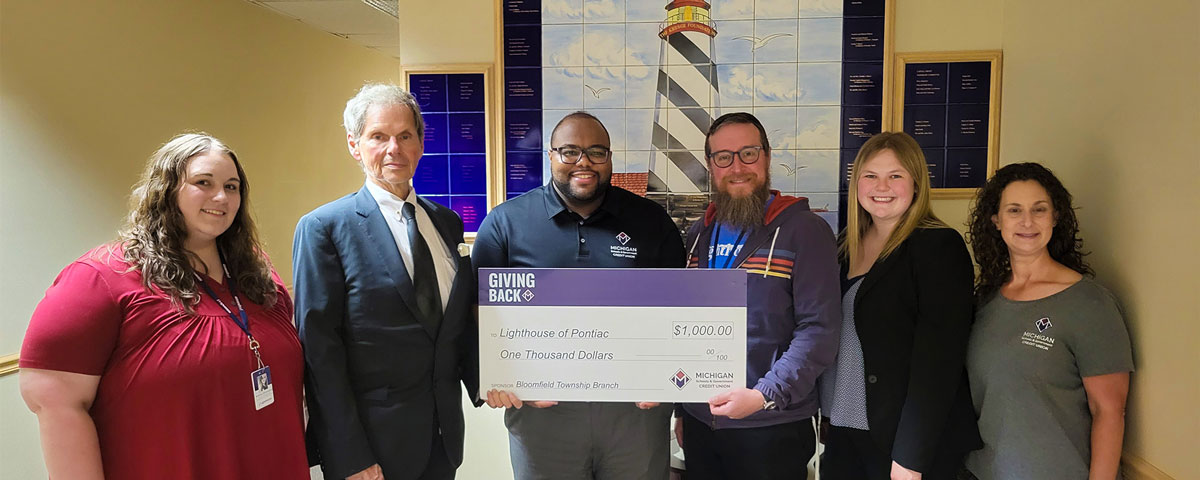 The Bloomfield Township branch team presented their Giving Back donation to Lighthouse of Pontiac. 