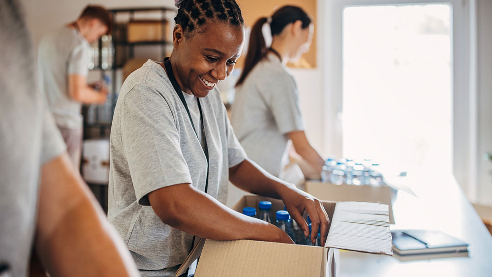 Volunteers packing donations