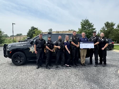 MSGCU's Shelby Township Branch at 26 and Van Dyke presents a donation to Washington Twp Police Department