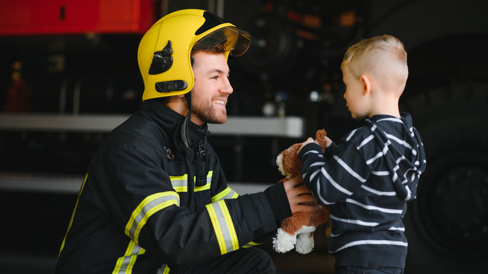 Firefighter and little boy