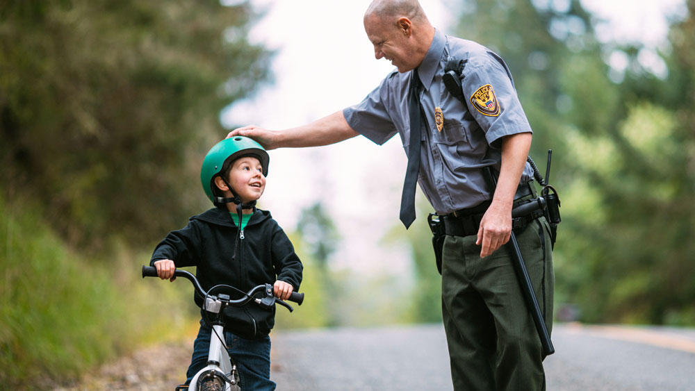 Child on bike and police officer