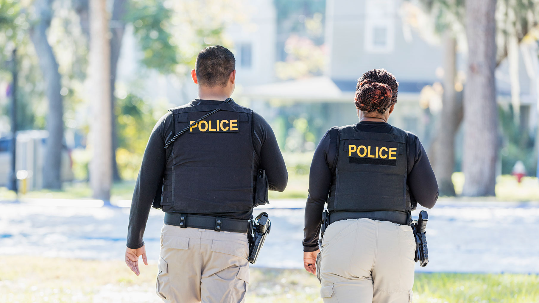 Two police officers walking away