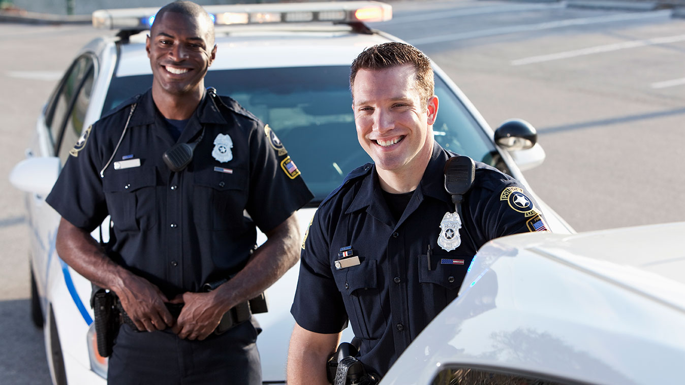 Two police officers smiling