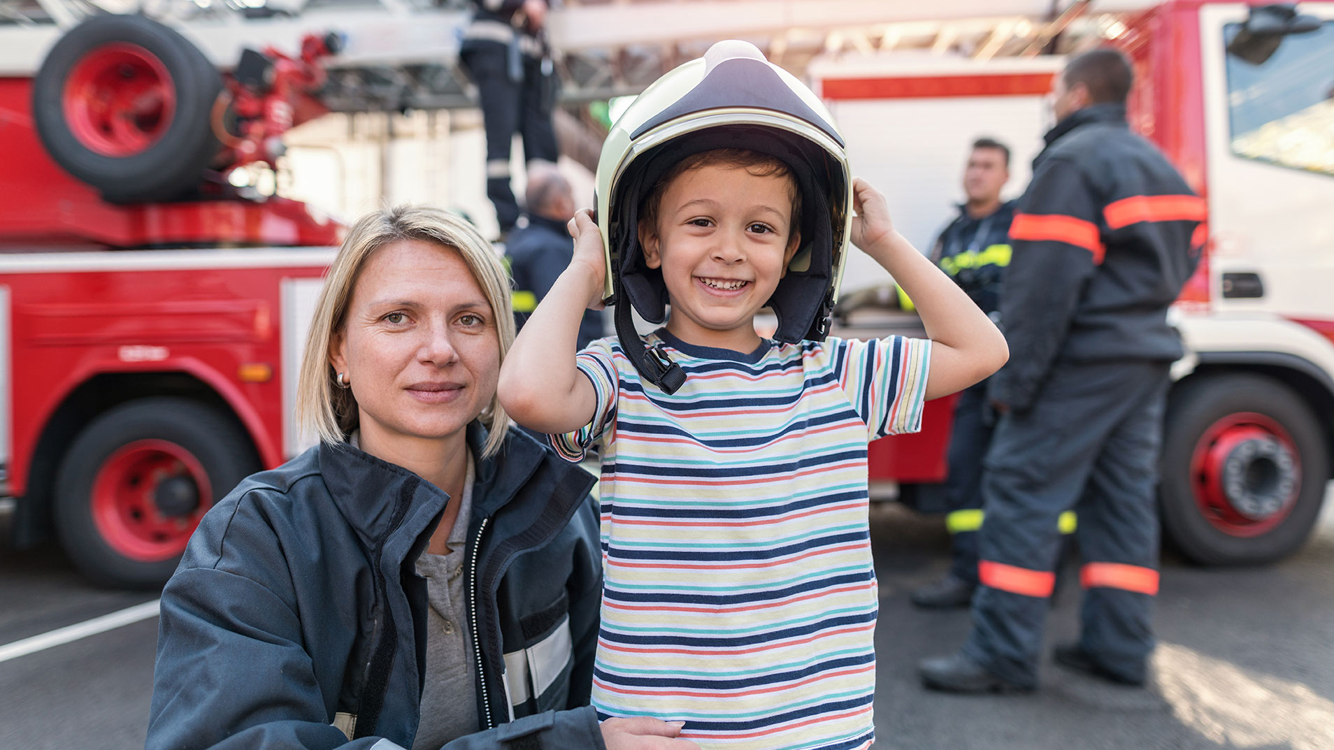 Child wearing fire helmet