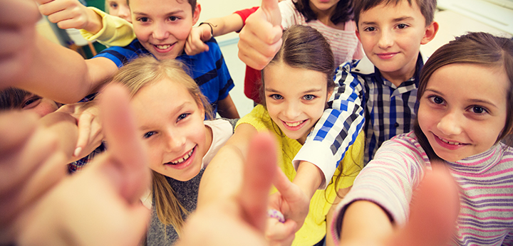 Students giving a thumbs up