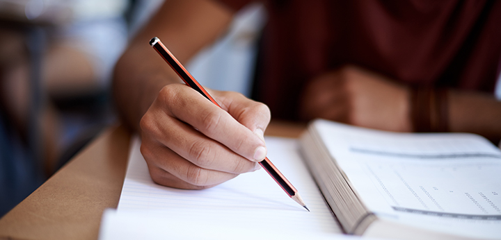 Writing in notebook